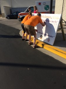 Attendees signing large banners honoring and memorializing Coach Pat Summitt