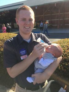 Dylan Cobble of Red Head Promo with his daughter ready for her first Republican rally.