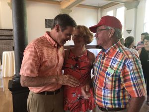 Lee talking with Powell businessman and wife Bruce and Lillian Williams